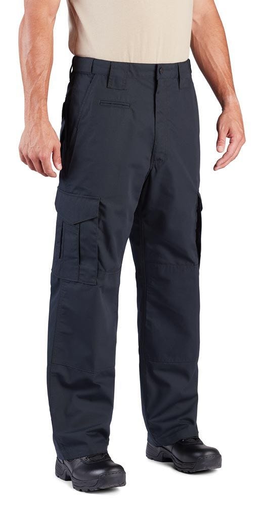 Person wearing black tactical pants on a white background