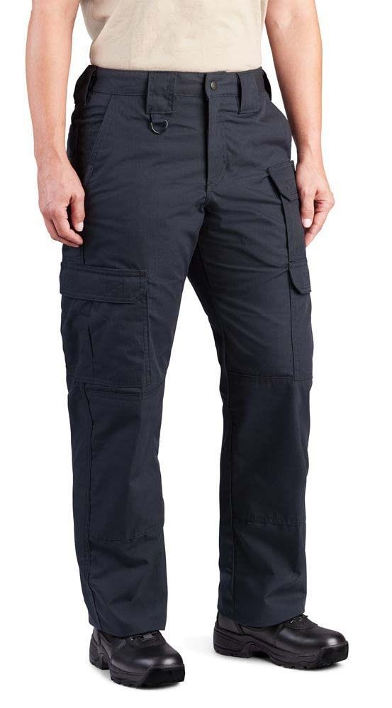 Person wearing dark blue tactical pants on a white background