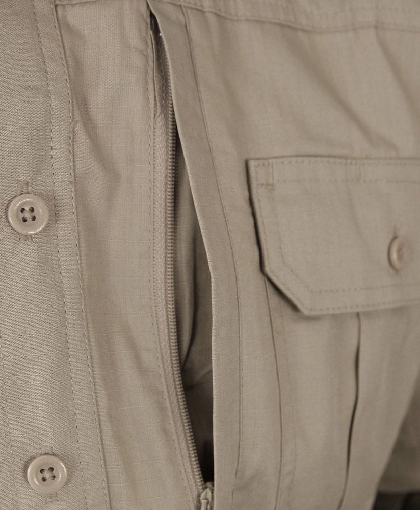 Close-up of a beige jacket with buttons and a zipper