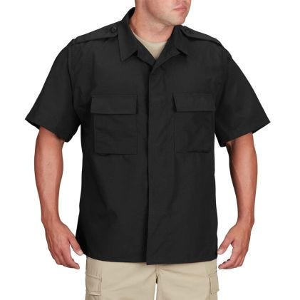 Black short-sleeve shirt worn by a person on a white background