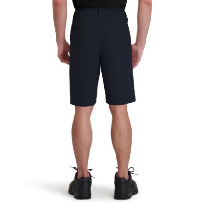 Person wearing navy shorts on a white background