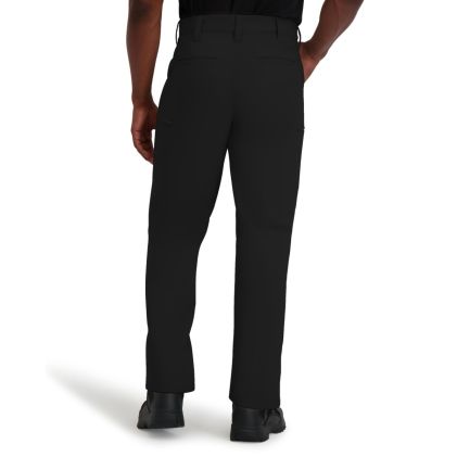 Black dress pants worn by a person on a white background
