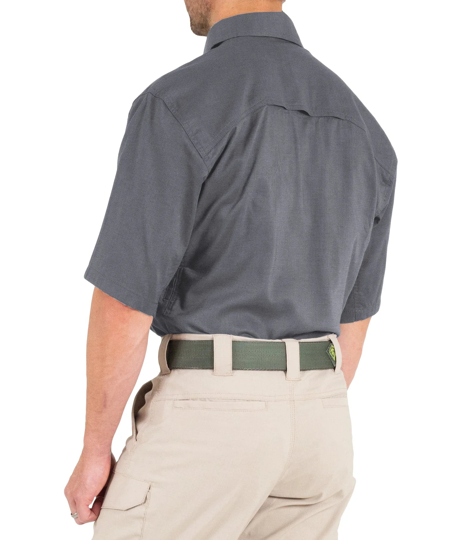Person wearing a gray short-sleeve shirt and beige pants on a white background