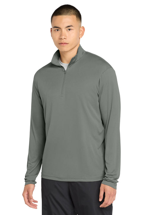 Man wearing a gray long-sleeve shirt with a quarter-zip on a white background