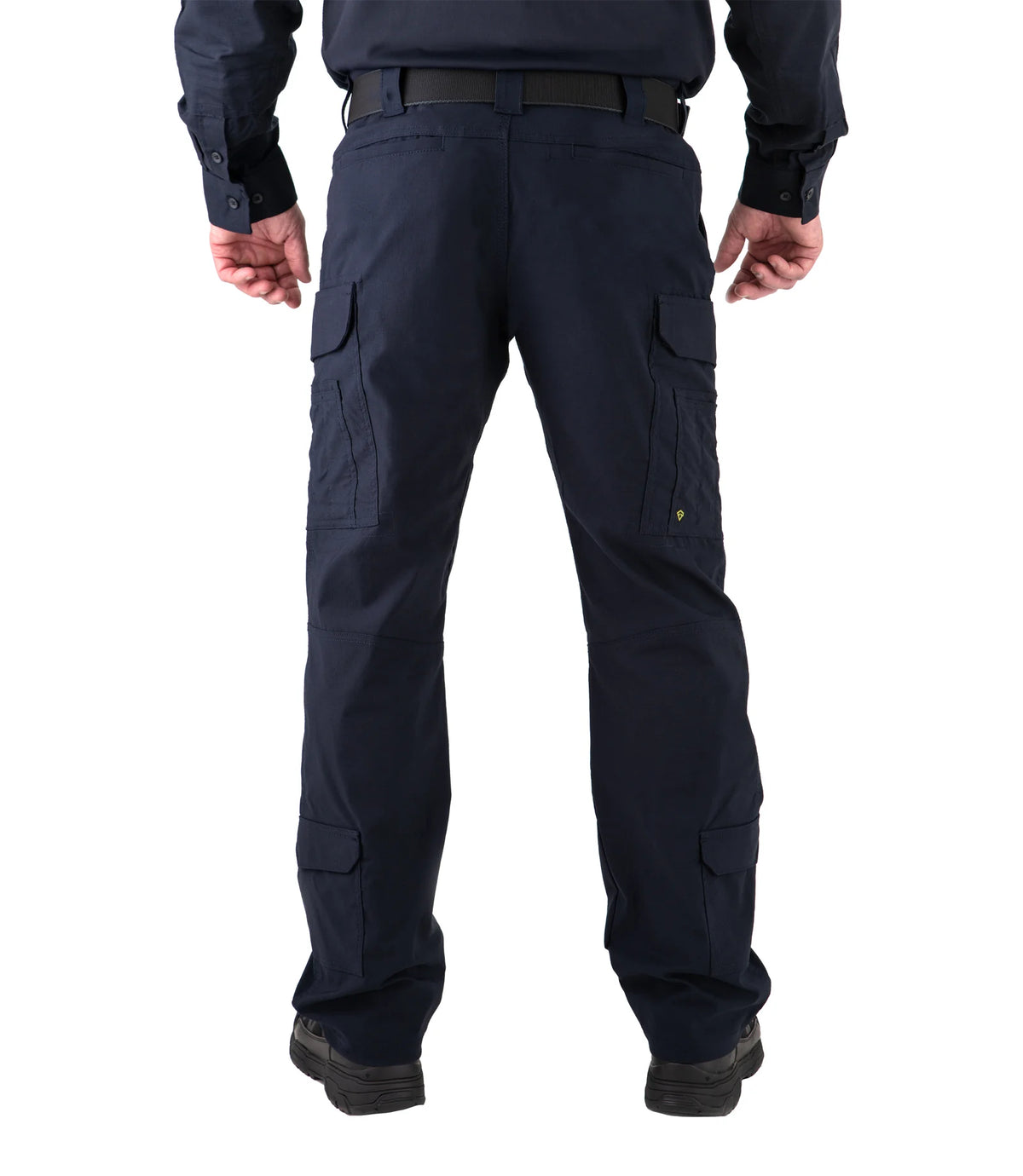Dark blue cargo pants worn by a person on a white background