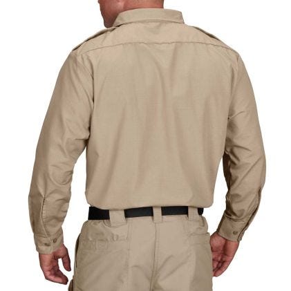 Person wearing a beige shirt and pants on a white background