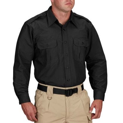 Person wearing a black shirt and beige pants on a white background
