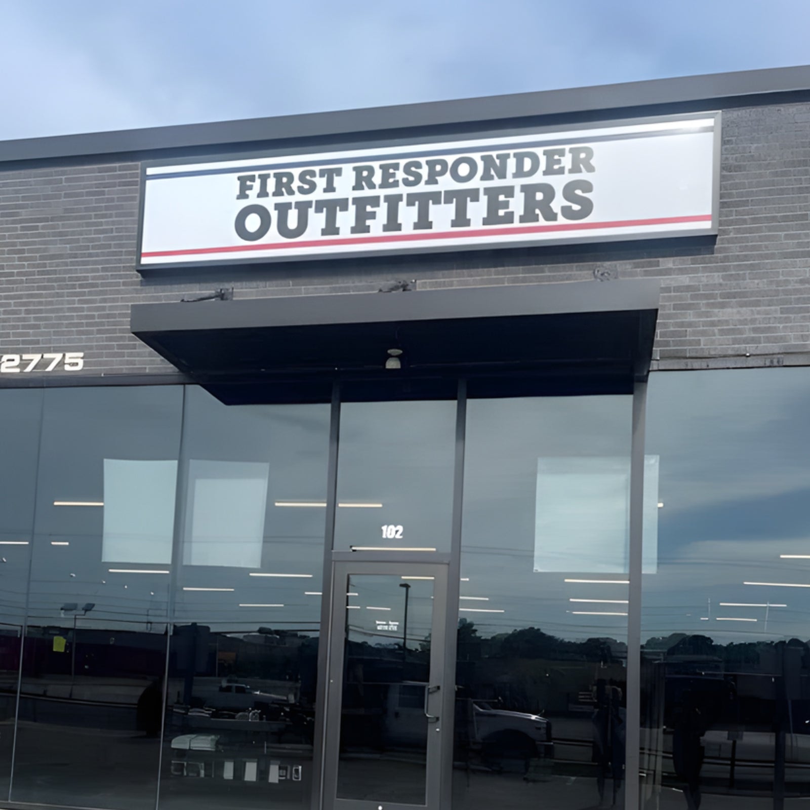 Storefront of First Responder Outfitters with a sign above the entrance.