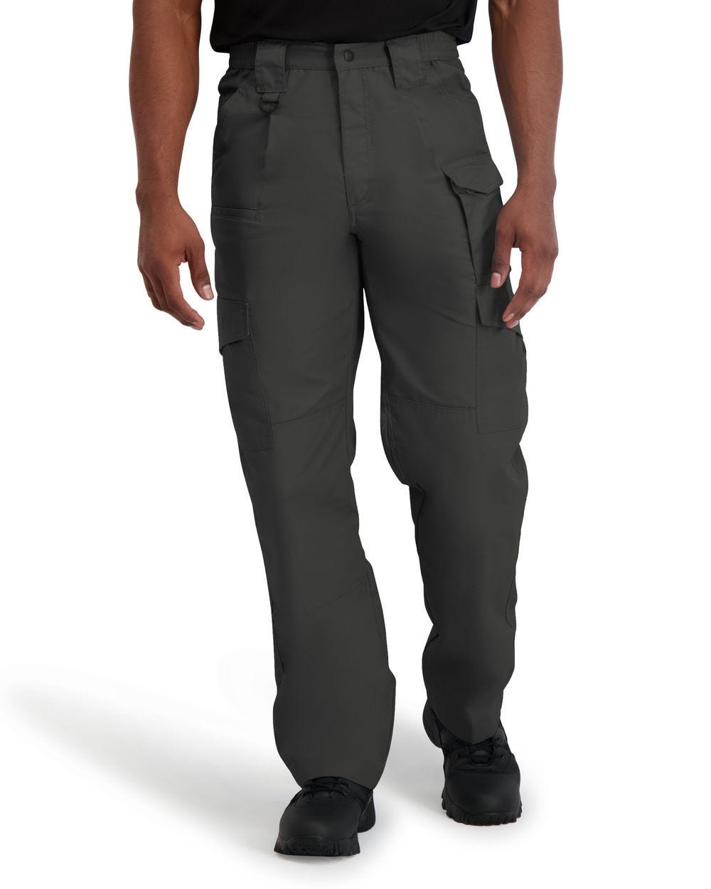 Person wearing dark gray cargo pants on a white background