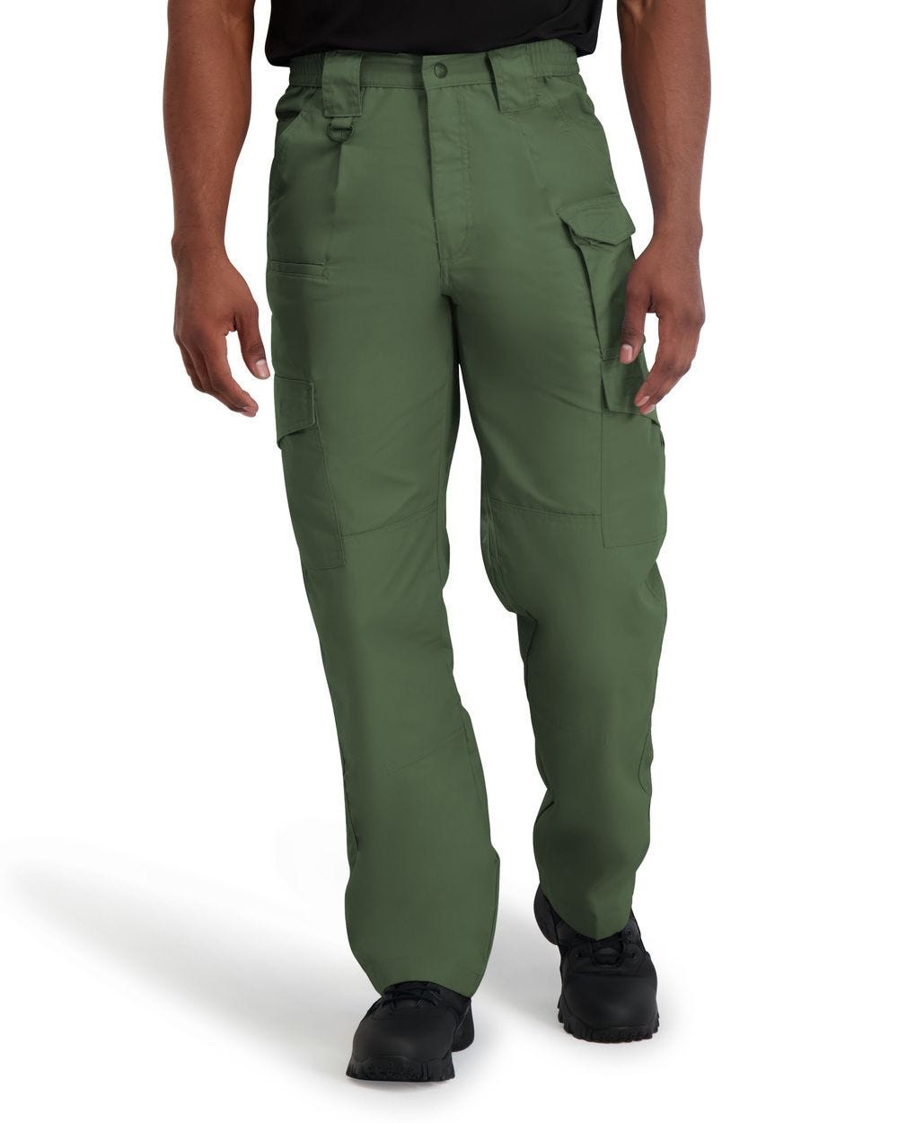 Green cargo pants worn by a person on a white background