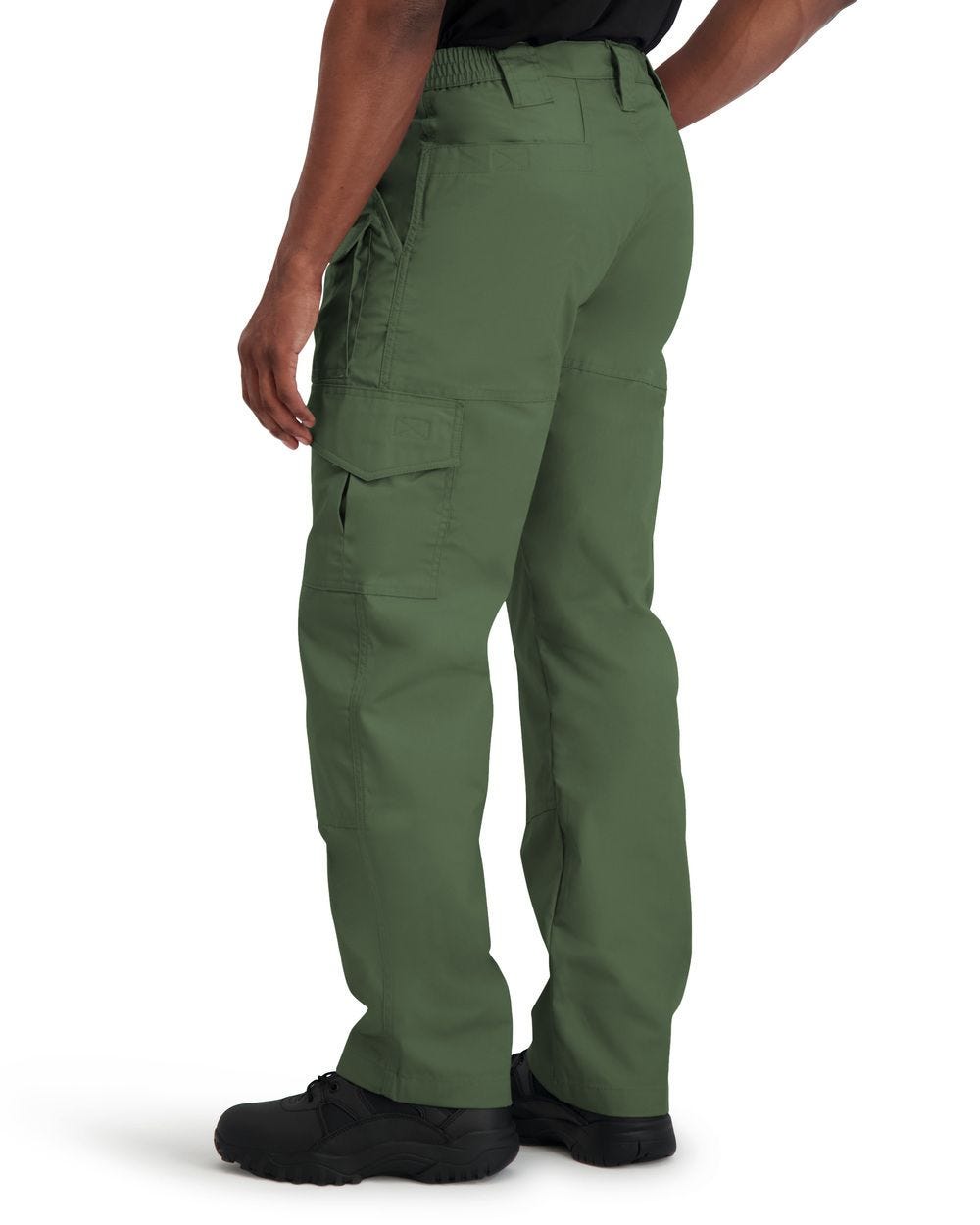 Green tactical pants worn by a person on a white background