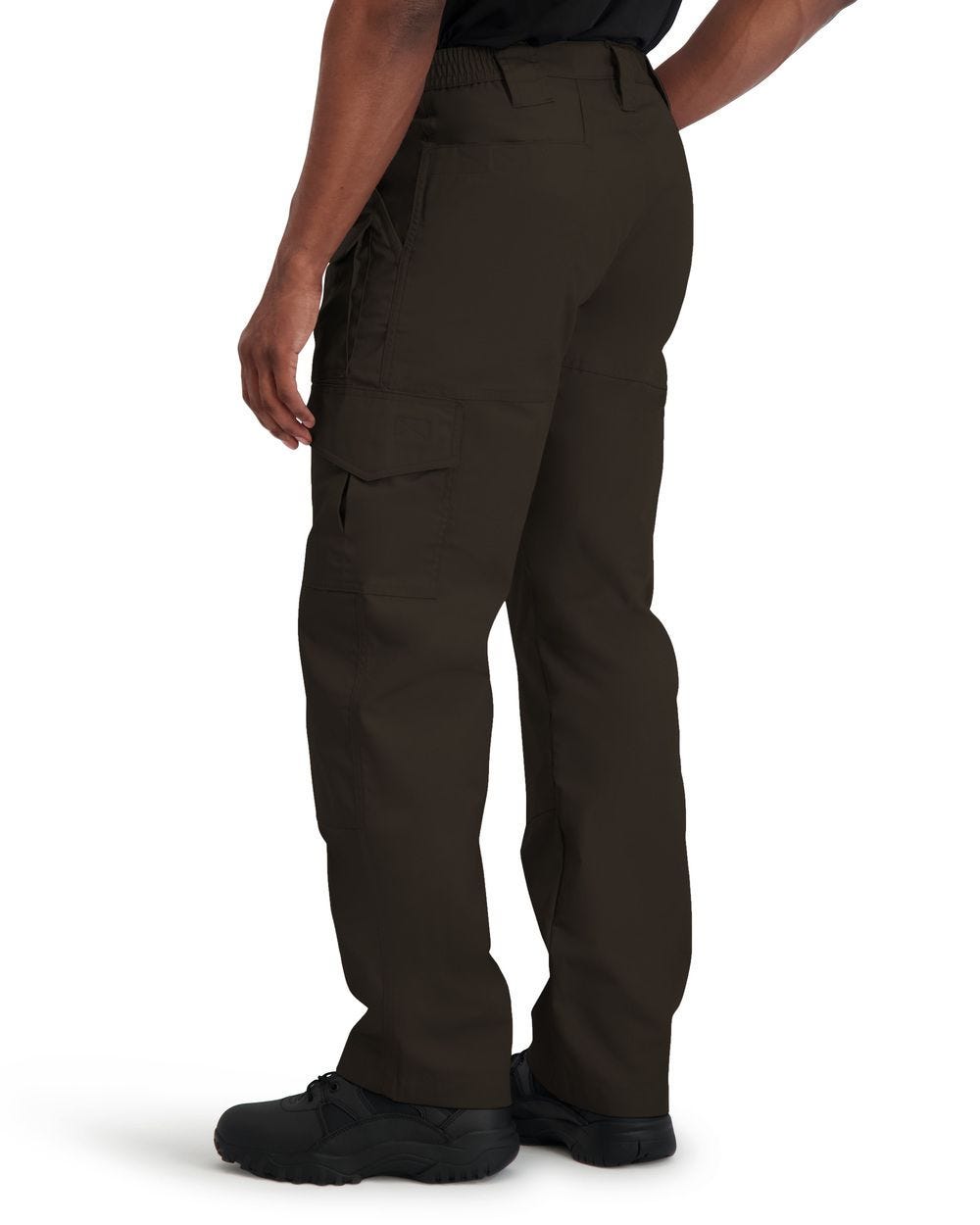 Brown tactical pants worn by a person on a white background