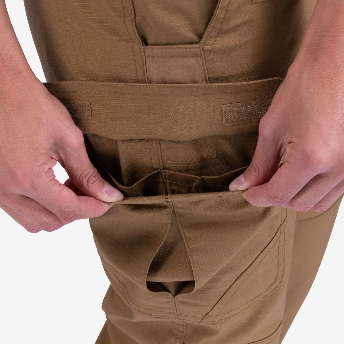 Brown tactical pants with multiple pockets and a visible brand logo on a white background.