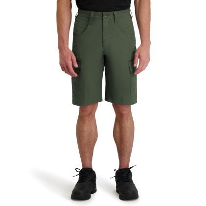 Person wearing green cargo shorts on a white background