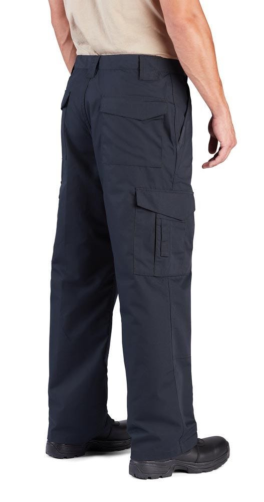 Person wearing black tactical pants on a white background
