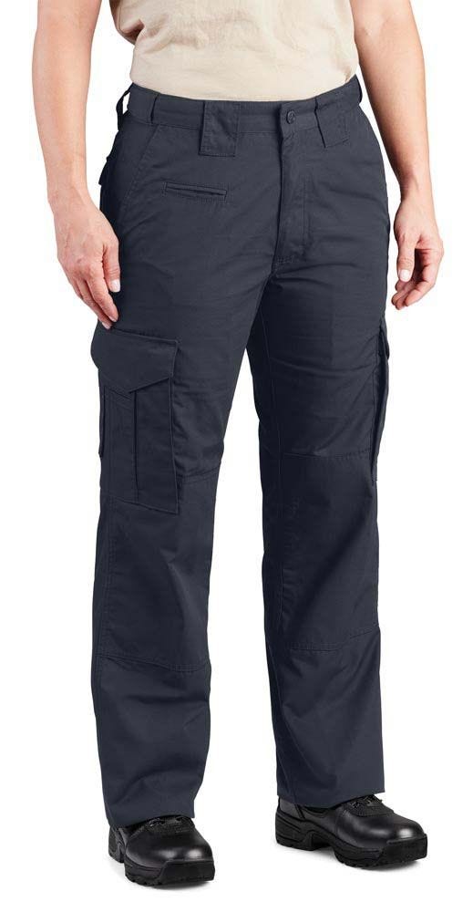 Person wearing navy cargo pants on a white background