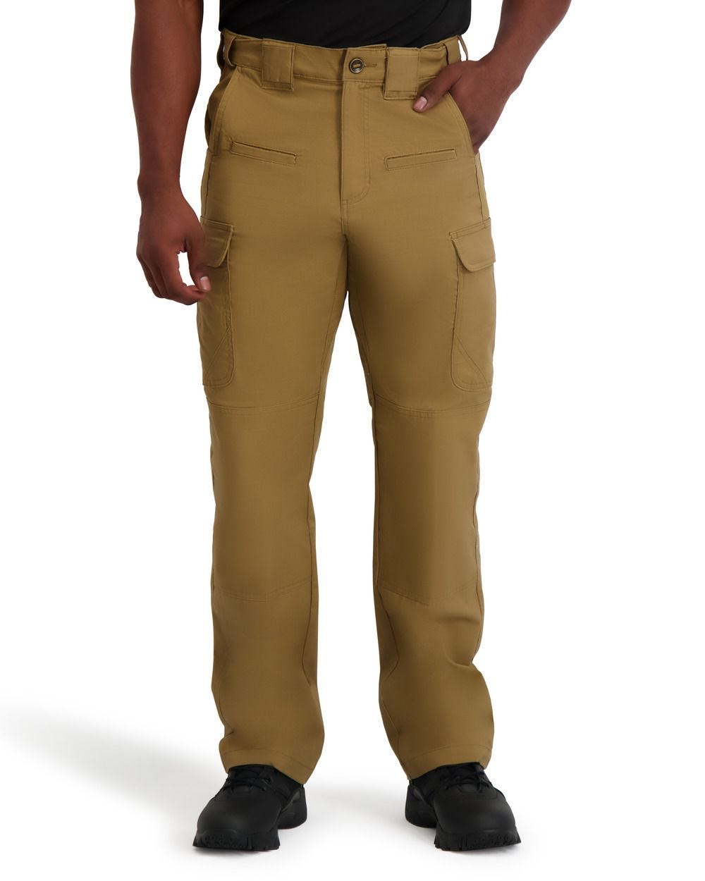 Tan pants worn by a person on a white background