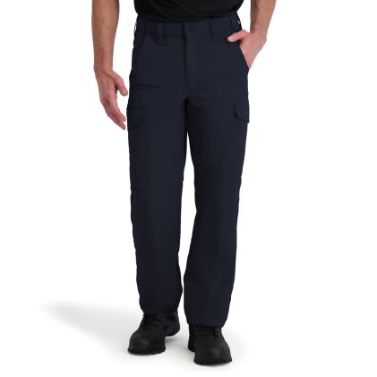 Person wearing navy blue cargo pants on a white background