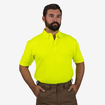 Man wearing a bright yellow polo shirt against a white background