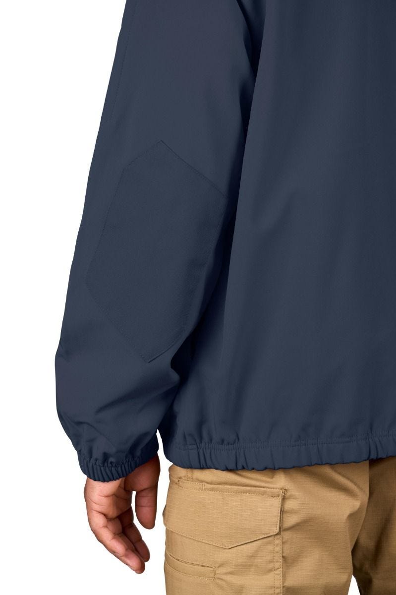 Navy blue jacket worn by a person on a white background