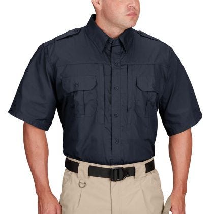 Navy short-sleeve shirt worn by a person on a white background