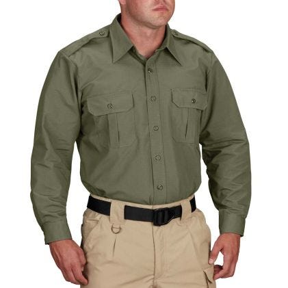 Person wearing a green shirt and beige pants on a white background