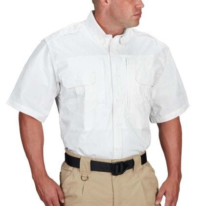 Man wearing a white short-sleeve shirt and beige pants on a white background